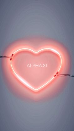 a neon heart with the word alphaxi written on it