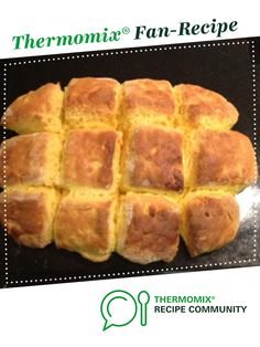 the bread is cut into squares and placed on a baking sheet to be cooked in