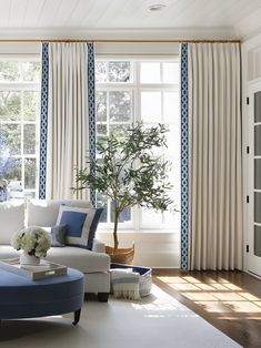 a living room with blue and white decor