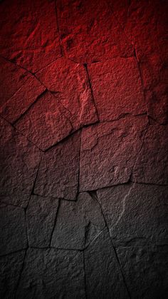 a red and black background with cracks in the concrete, which is very rough to see