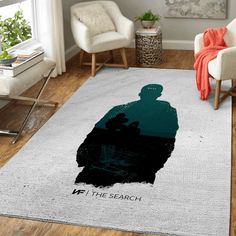 a living room area with a rug that has a silhouette of a man on it