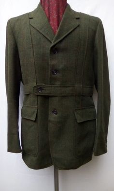 1960s Norfolk Tweed jacket by Burton. Dark green, light green, black and orange weave with orange check pattern. Four button, button fastening belt, two patch pockets to front, one internal breast pocket, action vents, centre vent and in very good worn condition. The lining is in good worn Mohair Suit, 70s Jeans, Riding Pants, Short Vest, Black And Orange, Tailored Suits, Jodhpur