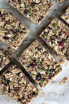 granola bars cut into squares on a sheet of parchment paper