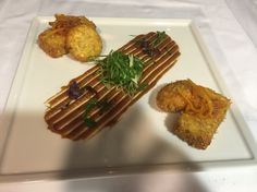 a white plate topped with food on top of a table