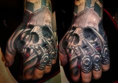 two hands that have tattoos on them and one has a skull in the middle of it