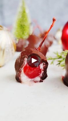 chocolate covered candies with christmas decorations in the background