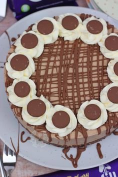 a chocolate cake with white frosting and sliced bananas in the middle on a plate