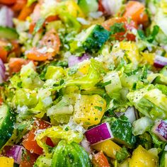 a colorful salad with lots of veggies in it