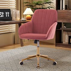 a pink office chair sitting on top of a rug