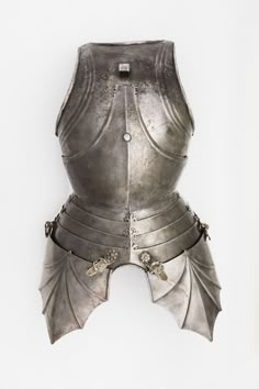 a metal armor with leaf decorations on the chest and shoulder, against a white background