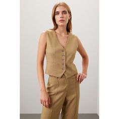 Green cotton (100% Acetate). Lining (100% Polyester). Vest. Sleeveless. V-neck. Front button closure. 21.5" from shoulder to hemline. Imported. Classic Spring Vest, Classic Spring Vest For Daywear, Elegant Tank Vest For Workwear, Fitted V-neck Tank Top For Daywear, Beige V-neck Tank Top For Work, Chic Daywear Vest With Button Closure, Linen Vest For Daywear, Summer Workwear Tank Vest, Elegant Sleeveless Cotton Vest