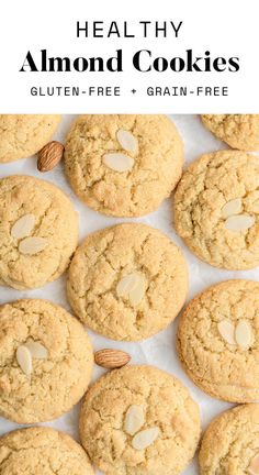 almond cookies are lined up on a sheet of parchment paper