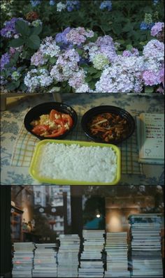 there are many different foods in bowls on the table with books and flowers behind them