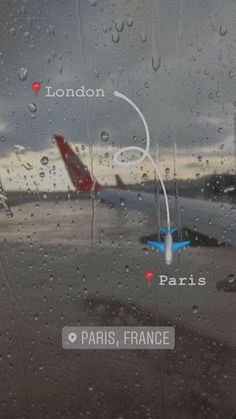 an airplane is seen through the rain covered window at london, paris, and los angeles