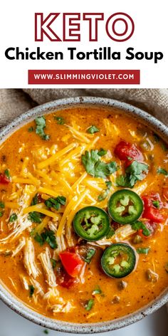 a bowl of chicken tortilla soup with cheese and jalapenos on top