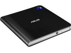 an asus laptop computer sitting on top of a white surface