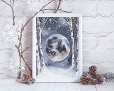 an image of a snowy night with the moon in the sky and pine cones next to it