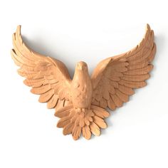 a wooden sculpture of an eagle on a white background