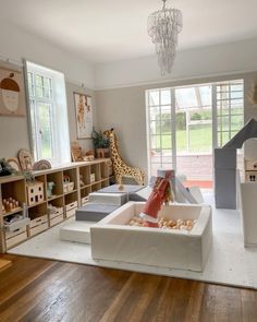 When I had my first kid, I was always worried about her playing area, and I wondered, "How to organize a playroom on a budget?” For sure, a separate White And Wood Playroom, Playroom On Main Floor, Kids Playroom Modern, Playroom With Windows, Ikea Shelves Playroom, Game Room Playroom Combo, Playroom With Sectional Couch, Loft Toy Room Playroom Ideas, Playroom Farmhouse Style