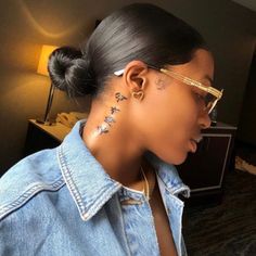 a woman with some piercings on her ear