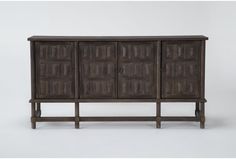 the sideboard is made out of wood and has four doors