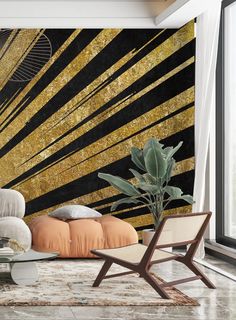 a modern living room with gold and black wallpaper