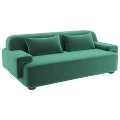 a green couch sitting on top of a white floor