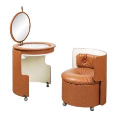 a brown chair and mirror sitting next to each other