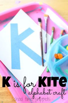 the letter k is for kite alphabet craft on a pink tray with paint and crayons