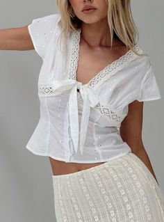 Tullock Top White White Going Out Top, White Tie Neck Cotton Top, V-neck Top With Lace Collar For Daywear, V-neck Tops With Lace Collar For Daywear, Lace Collar V-neck Top For Daywear, Fitted Feminine Eyelet Top, Elegant Cotton Eyelet Tops, Chic Lace Tops With Eyelet Details, Chic Lace Eyelet Tops