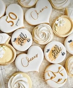 decorated cookies are arranged in the shape of hearts