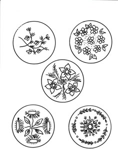 four plates with flowers and leaves on them