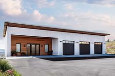 an artist's rendering of a two car garage with three doors on each side