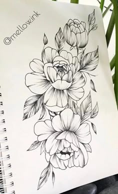 a notebook with flowers drawn on it