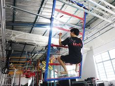 a man on a ladder climbing up to the ceiling