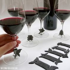 several wine glasses with different shapes and sizes are being held by someone's hand