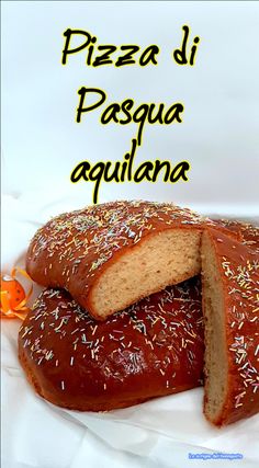 a loaf of bread with sprinkles on it and the words pizza di pasqua aguilana