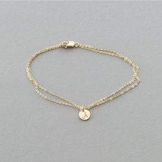 "Double Wrap Delicate Chain Tiny Disk Bracelet in Gold Fill, Rose Gold, or Sterling Silver. Personalize the Disk with an Initial or Leave it blank. Add some beautiful texture and sparkle to your everyday with this delicate wrap bracelet. The \"Dainty Double Wrap Initial\" Bracelet * LB220 D E T A I L S: * Delicate Double Wrap Chain * 6mm Tiny Disc with optional hand-personalization M A T E R I A L S: * 100% 14k gold fill, rose gold, or sterling silver * all sourced from USA or Italy * our lovely Wrap Armband, Double Chain Bracelet, Initial Charm Bracelet, Diamond Bracelet Design, Jewelry Staples, Gold Bracelets, Classy Jewelry, Delicate Chain, Initial Bracelet