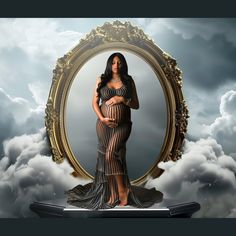 a pregnant woman standing in front of a mirror with clouds behind her and an ornate frame