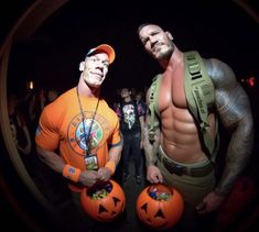 two men in halloween costumes standing next to each other