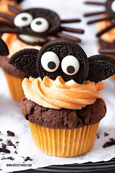 chocolate cupcakes decorated with oreo cookies and googly eyes are ready to be eaten