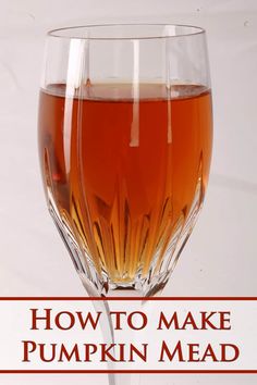 a glass filled with liquid sitting on top of a table