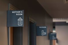 there is a sign that says mother's room on the door and other signs