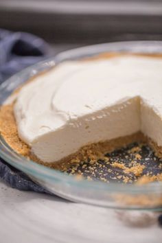 there is a pie on the table with one slice missing from it's crust