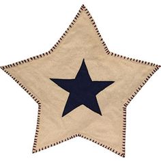 a blue and white star shaped rug with fringes