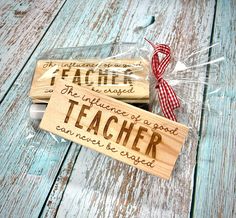 two personalized wooden teacher pencils on top of each other in cellophane