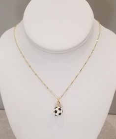 a necklace with a soccer ball on it