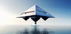 an upside down building in the middle of the ocean with blue sky and water around it