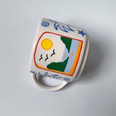 a ceramic ring with an image of a man's face on it