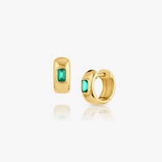 14k gold huggie earrings featuring emeralds in bezel settings adding a hint of sophictication to your ears. Luxury Elegant Huggie Earrings With Bezel Setting, Luxury Bezel Set Earrings, Huggie Earrings, Luxury Earrings, Tourmaline Earrings, Earring Trends, Jewelry Companies, Huggies Earrings, Designer Earrings